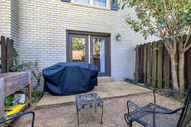 1625 Centerville Rd Unit 20, Tallahassee, FL 32308 - view of patio featuring grilling area and french doors