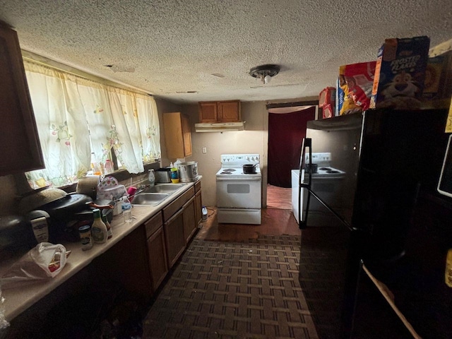 kitchen featuring sink, a textured ceiling, white electric range oven, and black fridge