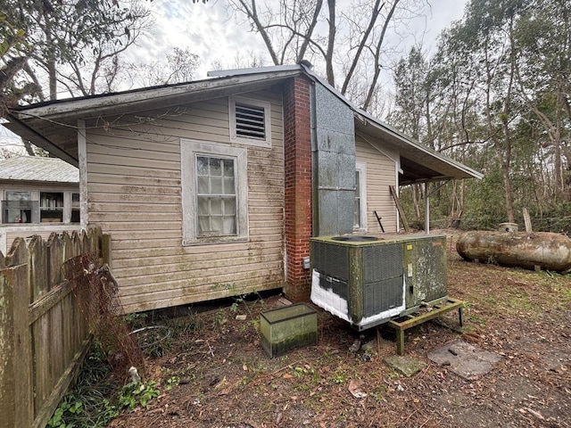 view of property exterior with central AC