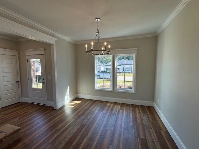 unfurnished dining area with ornamental molding, a chandelier, and dark hardwood / wood-style floors