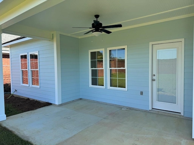 view of patio featuring ceiling fan