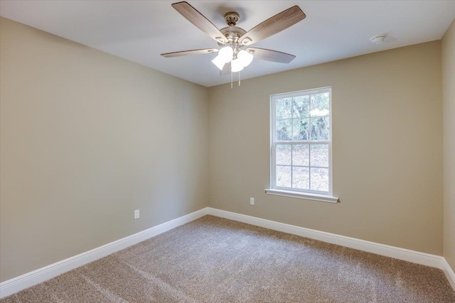 empty room featuring carpet flooring and ceiling fan