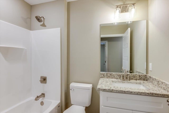 full bathroom featuring vanity, bathtub / shower combination, and toilet