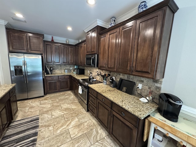 kitchen featuring ornamental molding, tasteful backsplash, dark brown cabinets, and stainless steel appliances