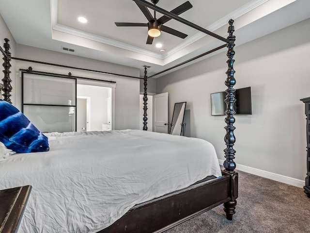 carpeted bedroom with ceiling fan, ornamental molding, and a tray ceiling