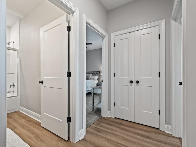 hallway featuring light wood-type flooring