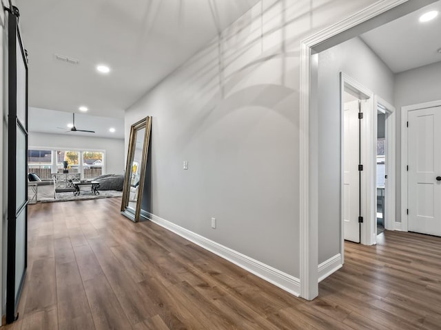 hallway featuring wood-type flooring