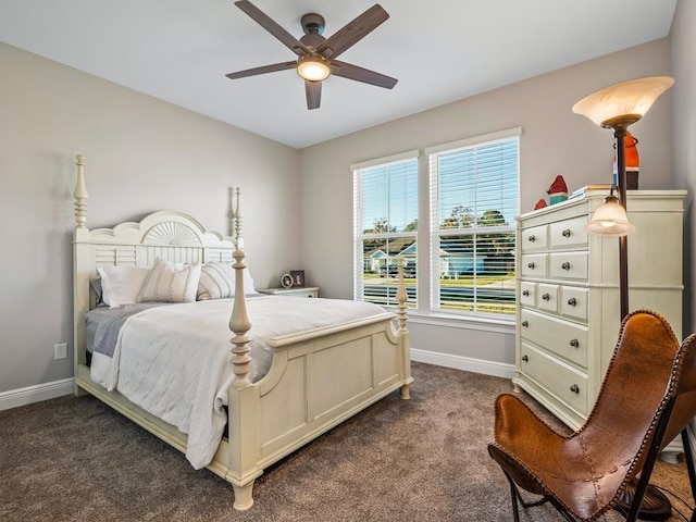 bedroom with dark colored carpet and ceiling fan