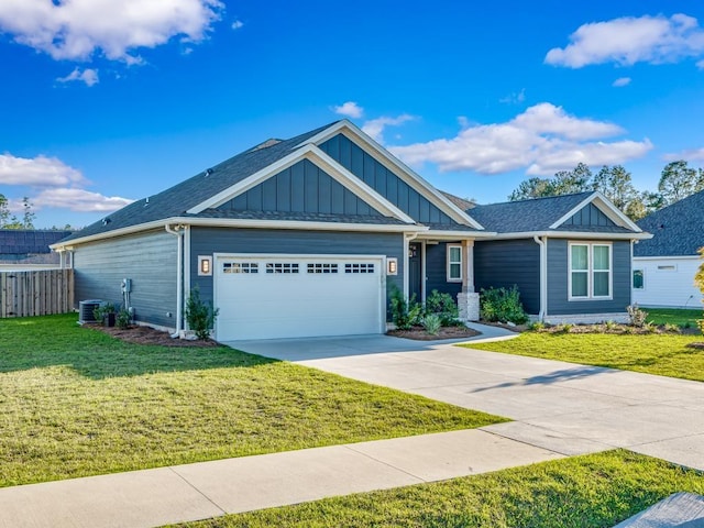 view of front of property featuring a front yard and a garage