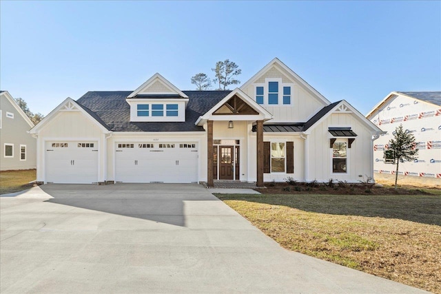 view of front of property with a garage and a front yard