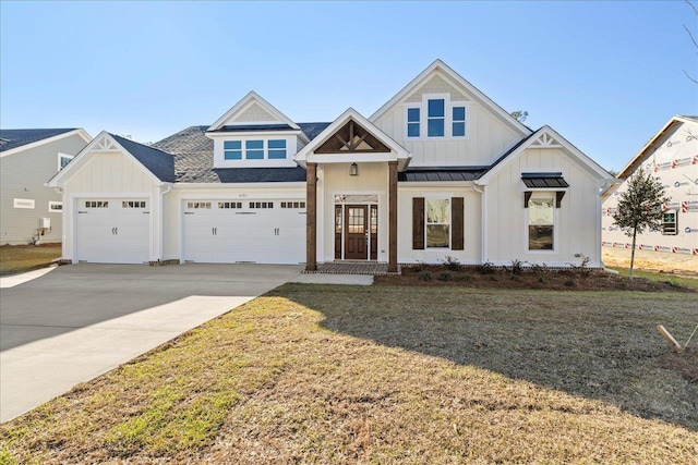 view of front of house with a front lawn and a garage