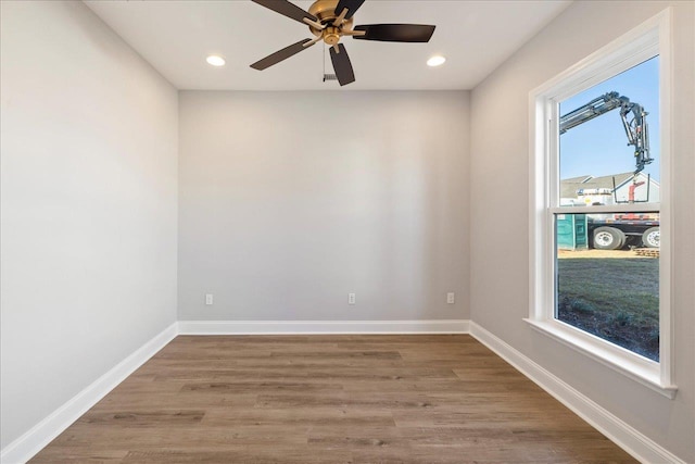 unfurnished room featuring ceiling fan and wood-type flooring