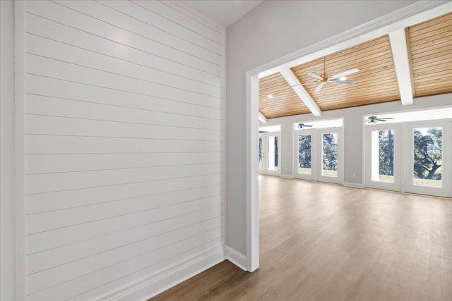 interior space with hardwood / wood-style flooring, plenty of natural light, lofted ceiling with beams, and wooden ceiling