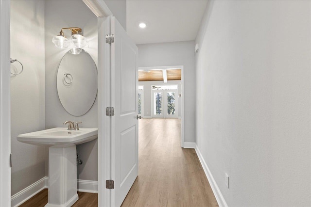 bathroom with hardwood / wood-style floors