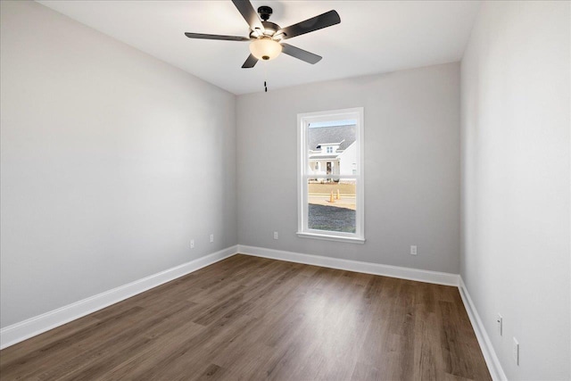 empty room featuring hardwood / wood-style flooring and ceiling fan