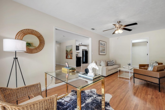 2917 Greenon Ln, Tallahassee, FL 32304 - living area featuring light wood-style floors, a ceiling fan, and baseboards