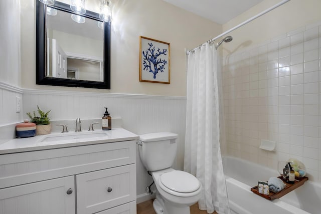 2917 Greenon Ln, Tallahassee, FL 32304 - full bath with wainscoting, vanity, toilet, and shower / bath combo