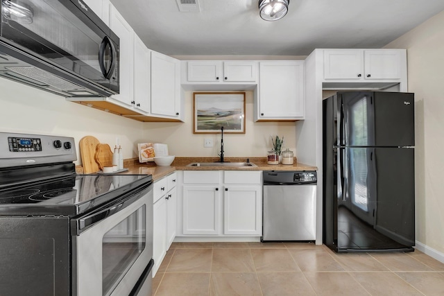 2917 Greenon Ln, Tallahassee, FL 32304 - kitchen with black appliances, a sink, white cabinetry, and stone counters