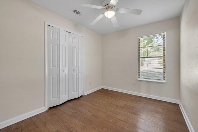 2917 Greenon Ln, Tallahassee, FL 32304 - unfurnished bedroom with wood finished floors, a closet, baseboards, and a ceiling fan
