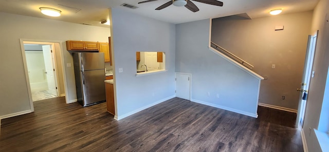 interior space featuring ceiling fan, dark hardwood / wood-style flooring, and sink