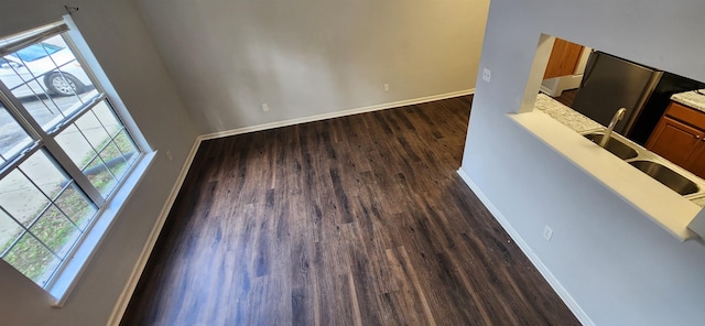 interior space with hardwood / wood-style floors and sink