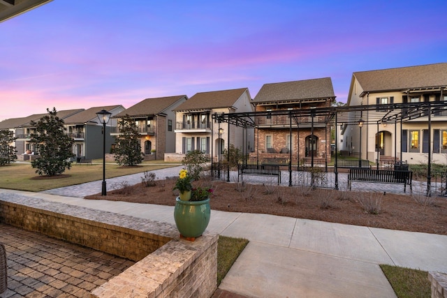 view of front of house featuring a residential view and a pergola