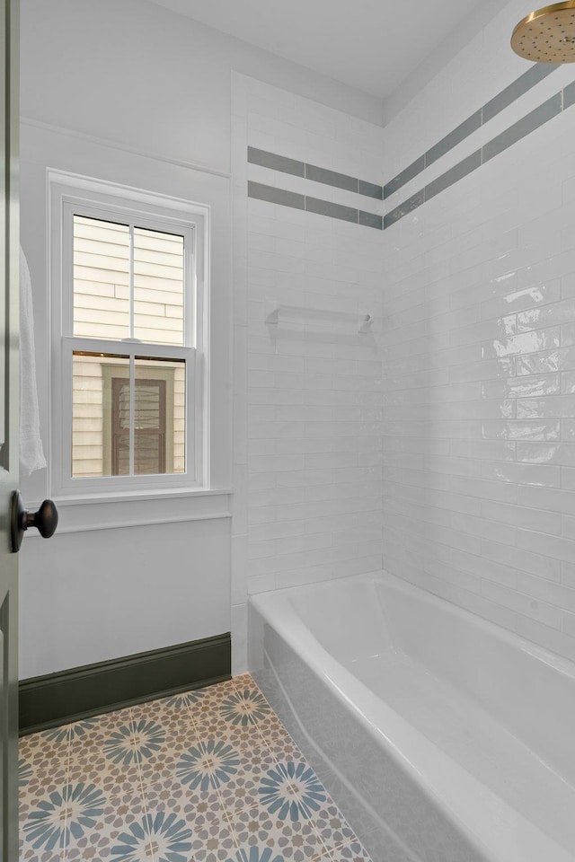 bathroom with bathing tub / shower combination