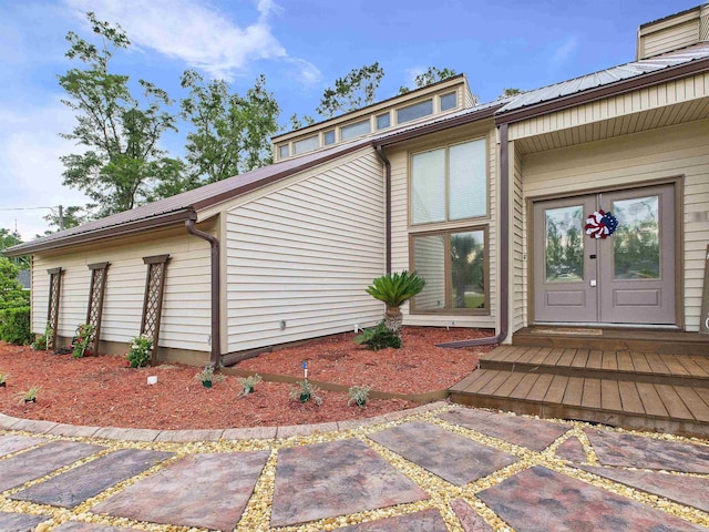 310 Glenridge Rd, Perry, FL 32348 - doorway to property with french doors and metal roof