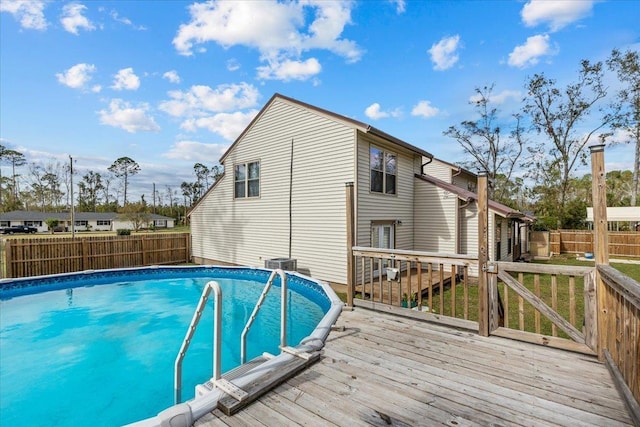 310 Glenridge Rd, Perry, FL 32348 - view of swimming pool with a deck, a fenced backyard, and central air condition unit