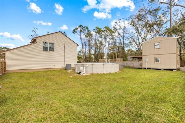 310 Glenridge Rd, Perry, FL 32348 - view of yard featuring an outdoor pool, a deck, and central air condition unit