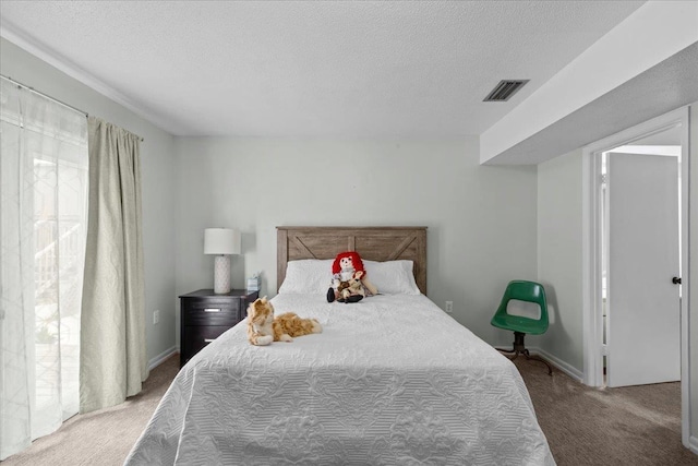 310 Glenridge Rd, Perry, FL 32348 - carpeted bedroom featuring a textured ceiling and baseboards