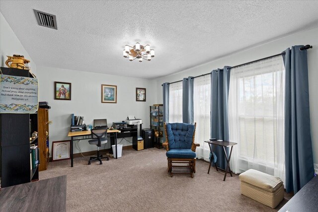 310 Glenridge Rd, Perry, FL 32348 - carpeted home office with a textured ceiling and a chandelier