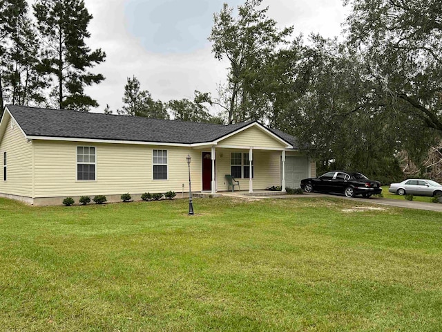 view of front of home featuring a garage, a porch, and a front lawn