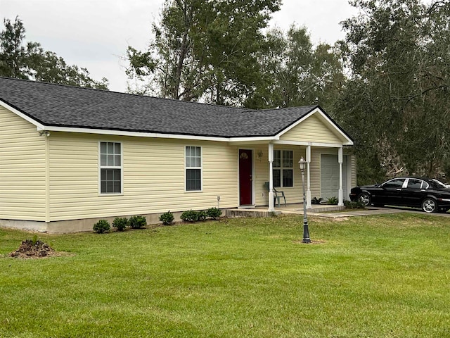 view of front facade with a front yard and covered porch