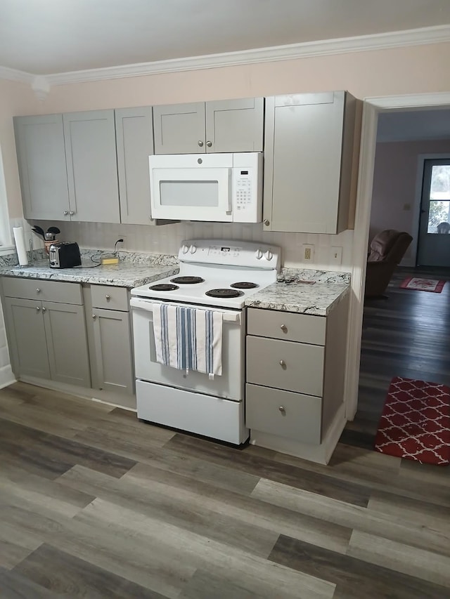 kitchen featuring gray cabinetry, white appliances, dark hardwood / wood-style flooring, and crown molding