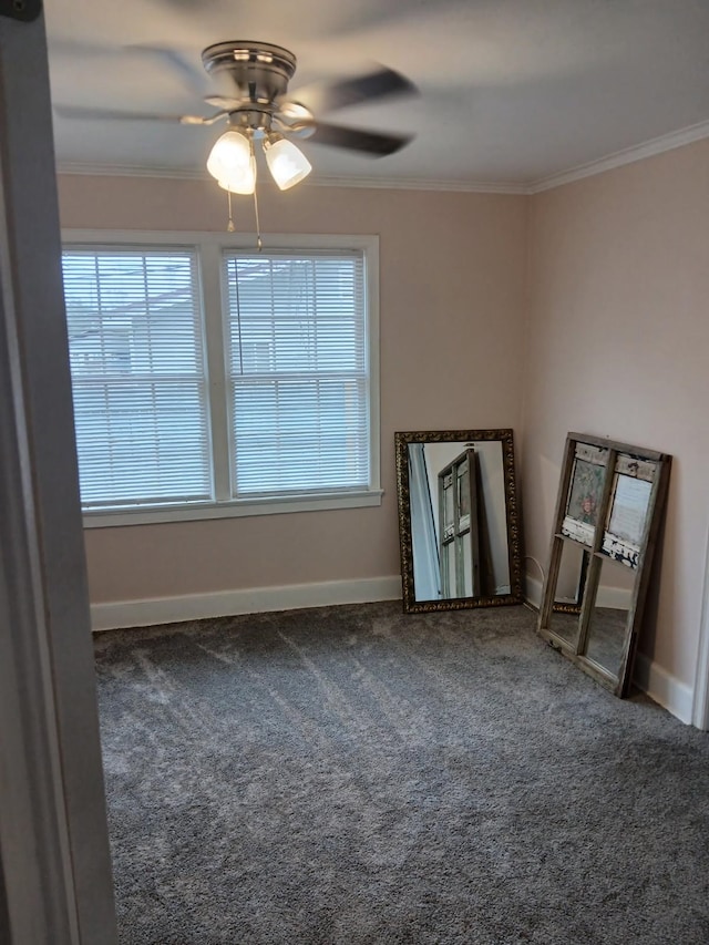 carpeted spare room featuring ornamental molding and ceiling fan