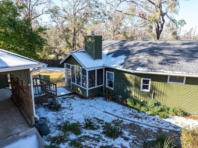 back of house with a sunroom