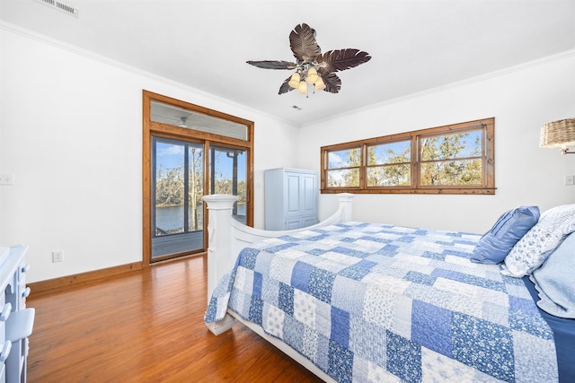 bedroom featuring crown molding, access to outside, ceiling fan, and hardwood / wood-style flooring