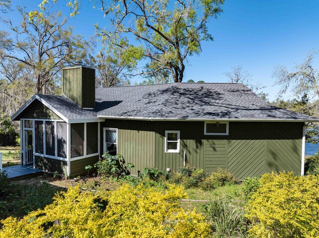 exterior space with a sunroom and a deck