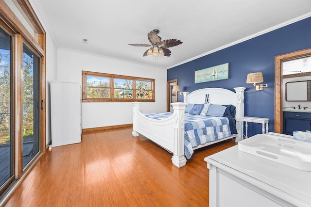 bedroom featuring multiple windows, ornamental molding, access to outside, and ceiling fan