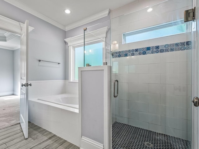 bathroom with ornamental molding and plus walk in shower