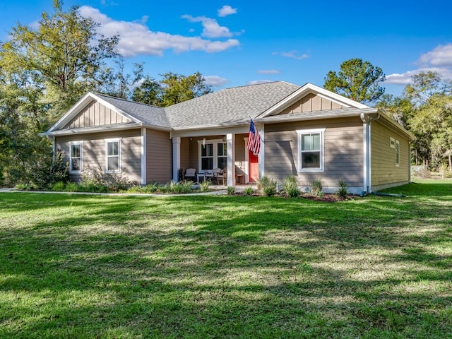 view of front of property with a front lawn and covered porch