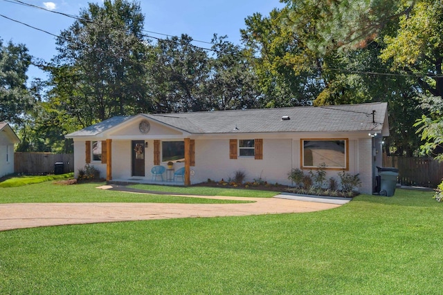 single story home featuring a front lawn and central AC