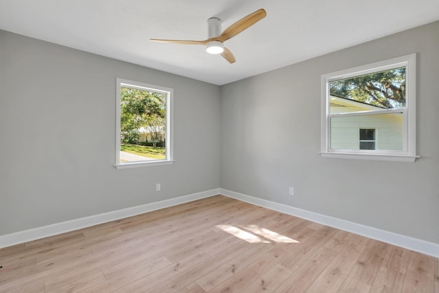 empty room featuring ceiling fan and light wood-type flooring