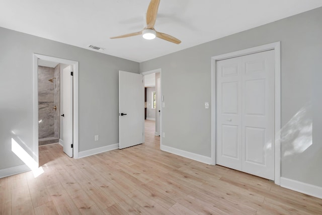 unfurnished bedroom with ceiling fan, light hardwood / wood-style floors, connected bathroom, and a closet