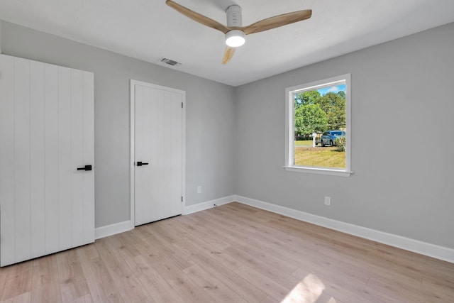 empty room featuring light hardwood / wood-style floors and ceiling fan