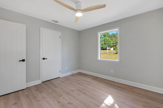 spare room featuring ceiling fan and light wood-type flooring