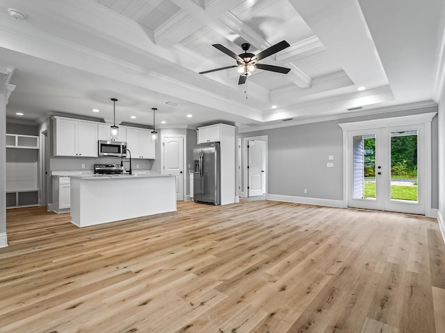 unfurnished living room with french doors, coffered ceiling, crown molding, light hardwood / wood-style flooring, and beamed ceiling