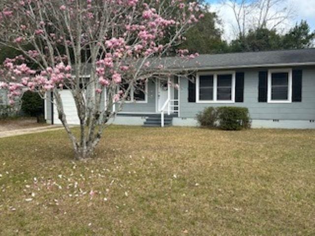 view of front of home with a front yard