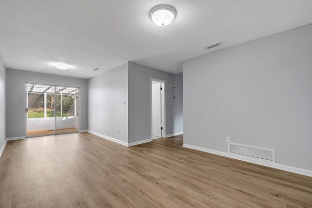 unfurnished room featuring light hardwood / wood-style floors